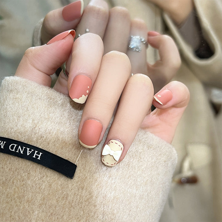 Artistic nail nails with decorative bow designs and French tips Bowlift