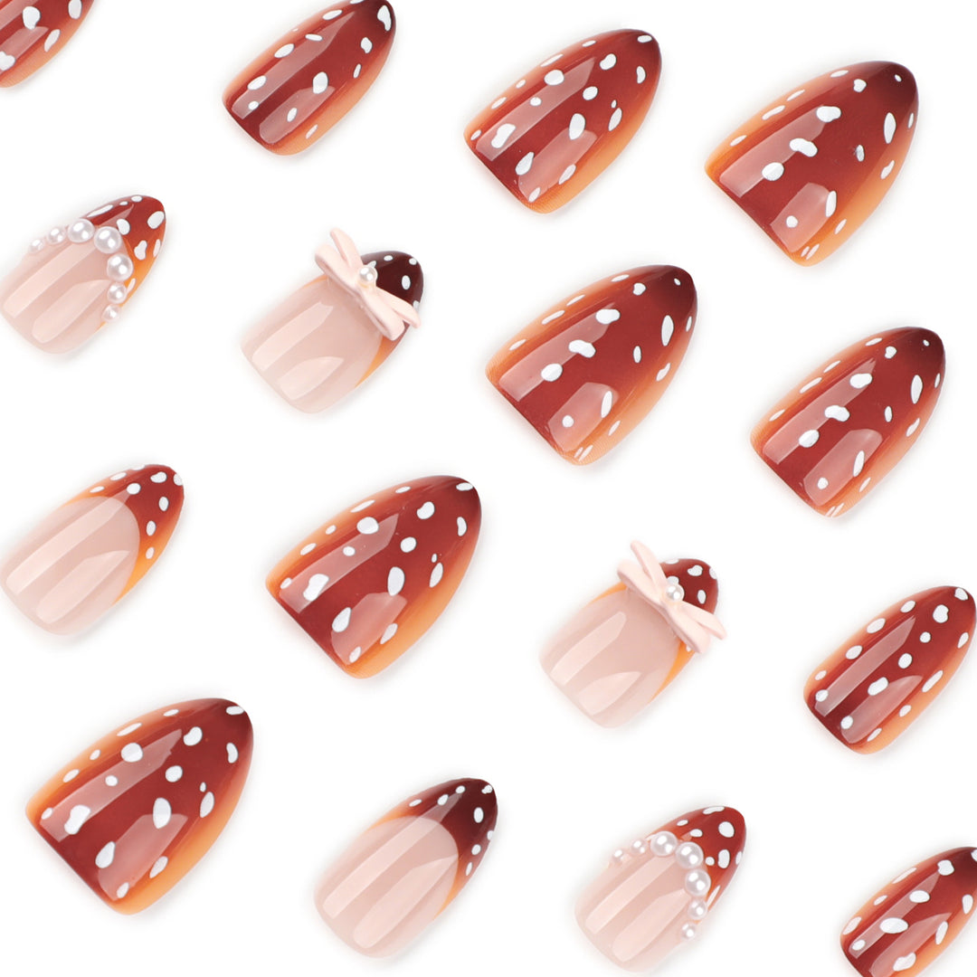 Artificial nail art with dot pattern and bow accents Bowlift