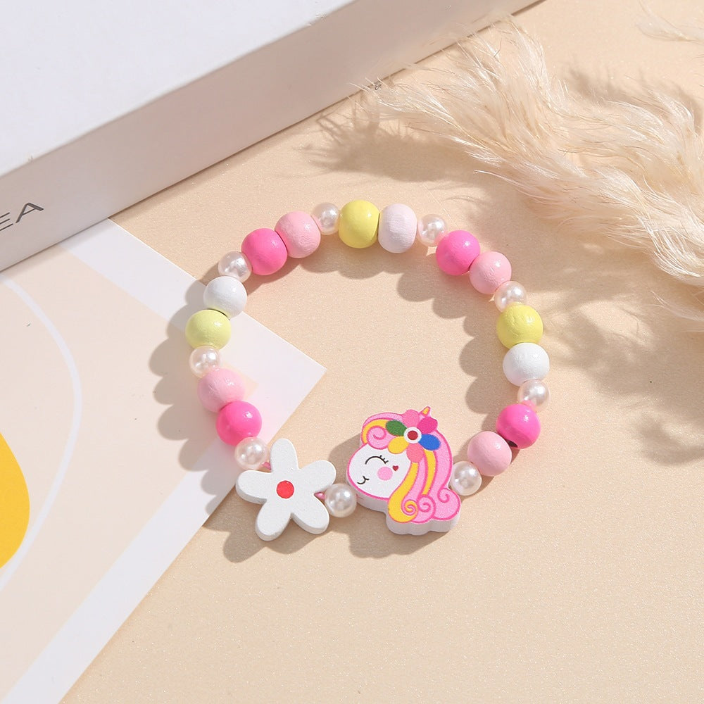 Playful children's bracelet with unicorn and flower motif Bowlift