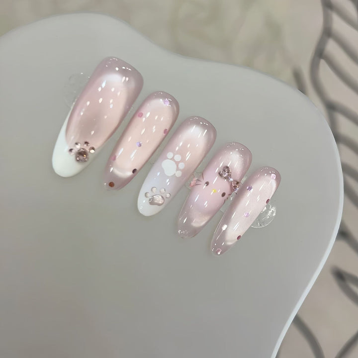 Artificial nail tips with playful penguin and paw print design Bowlift