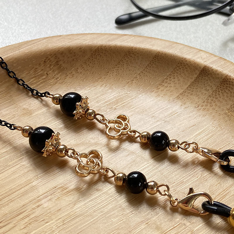 Filigree glasses chain holder with pearls and golden accents Bowlift