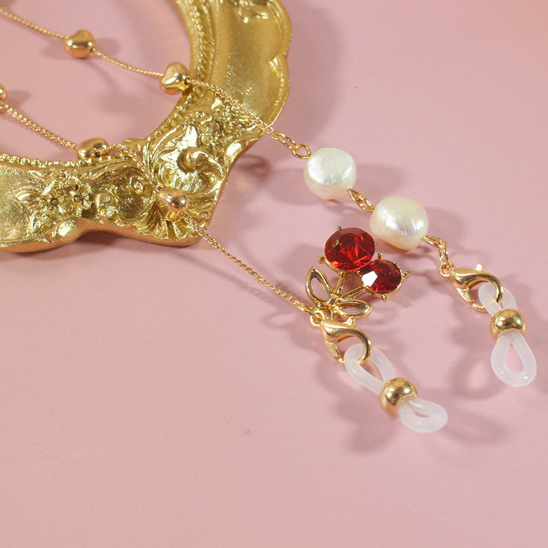 Elegant jewelry ribbon with pearls and silver accents Bowlift
