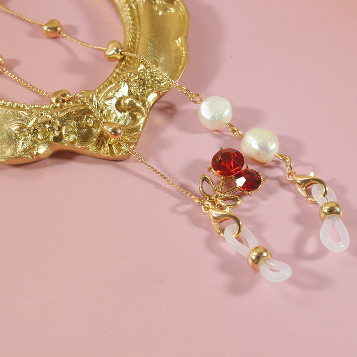 Elegant jewelry ribbon with pearls and silver accents Bowlift