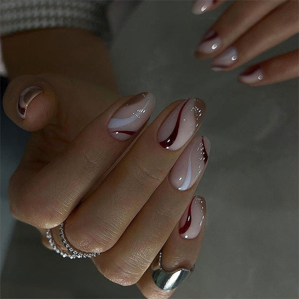 Elegant Nail Art with Modern Wave Pattern and Glitter Accents Bowlift