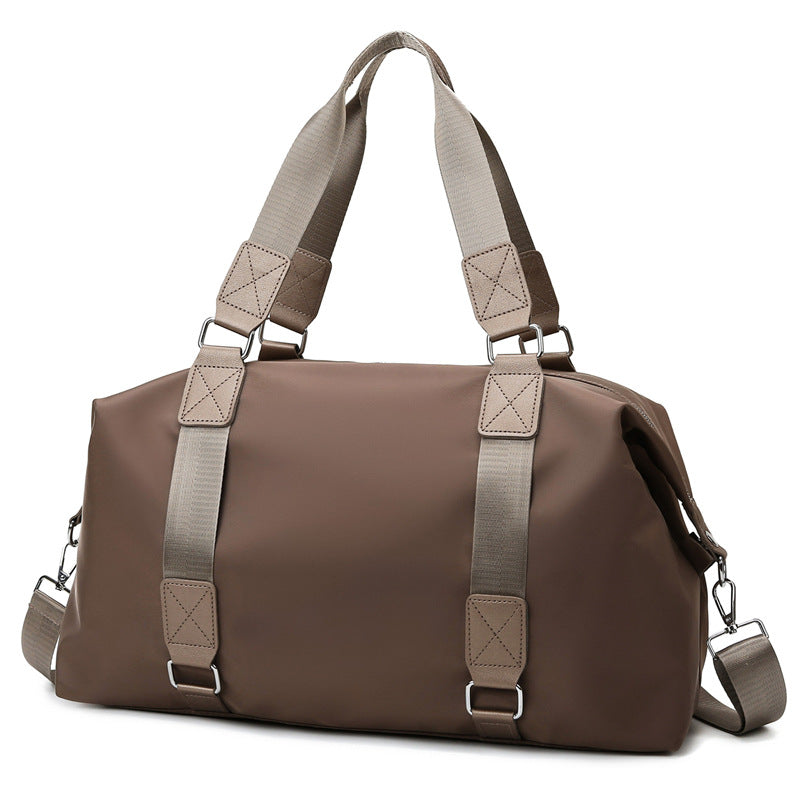 Sports bag with ergonomic carrying handles and versatile interior Bowlift
