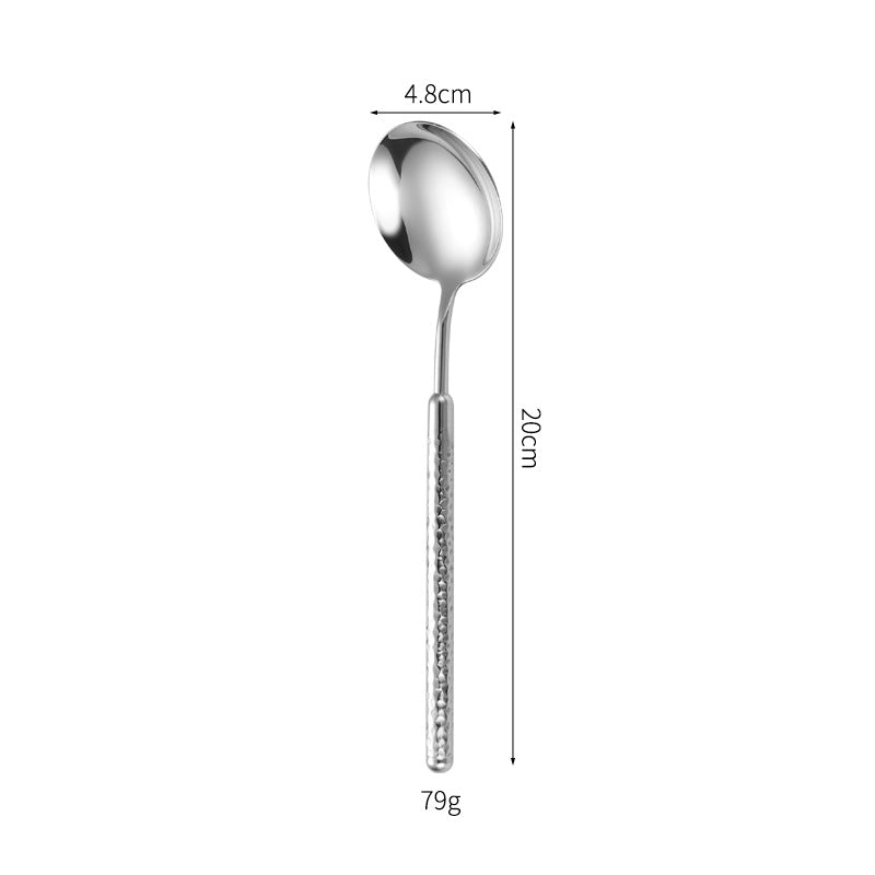 Elegant dessert spoon with elaborate handle design Bowlift