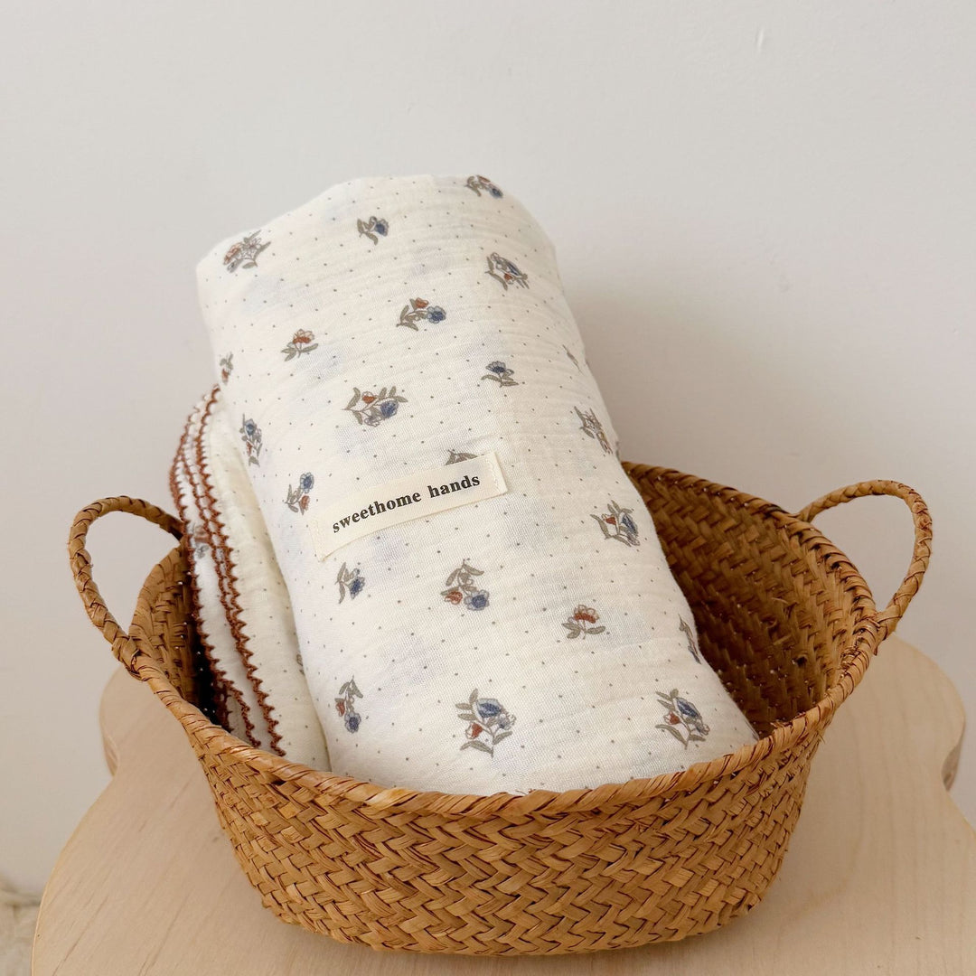Unisex Muslin Blanket with delicate floral design and elegant ruffles Bowlift