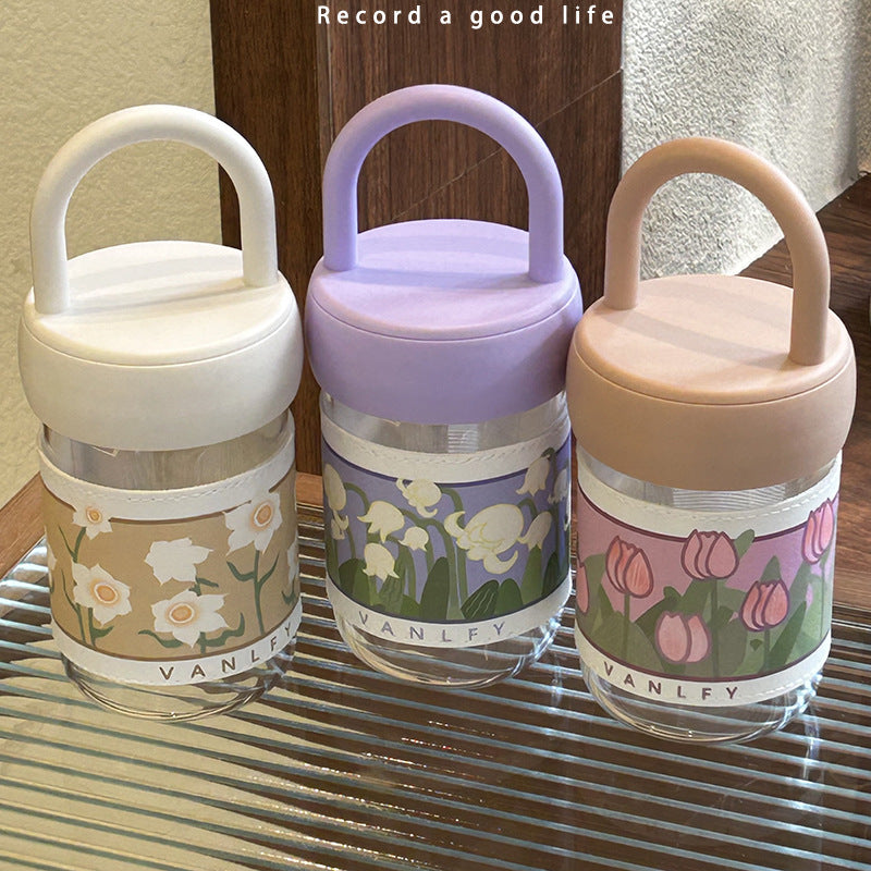 Women's insulated drinking bottle with ergonomic carrying handle and elegant flower design Bowlift