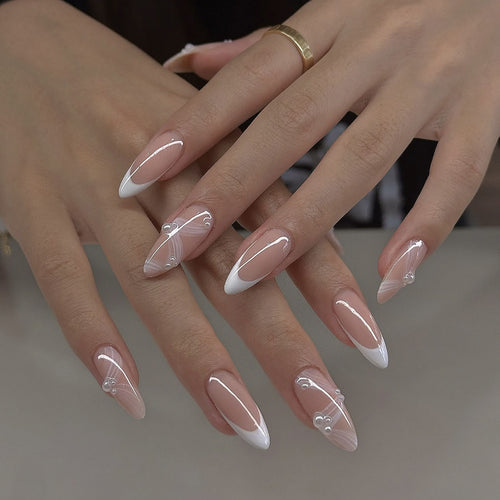 Creative acrylic nail set with elegant tips and glitter decorations Bowlift