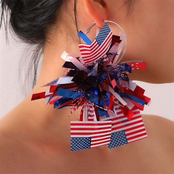 Women with eye-catching pompom hoops with lametta tassels and lightweight wire closure Bowlift