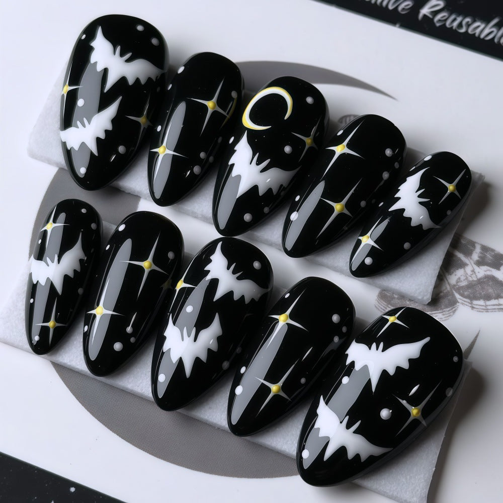 Artificial nails in creative Halloween bat design Bowlift