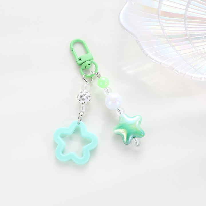 Playful keychain with floral and star motif Bowlift