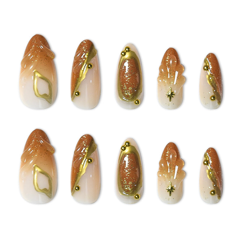 Luxurious Press-On Nail Set with Ornate Gold Detailing Bowlift