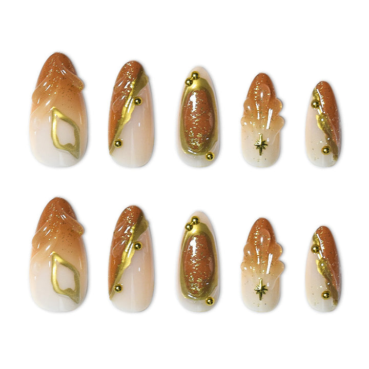 Luxurious Press-On Nail Set with Ornate Gold Detailing Bowlift