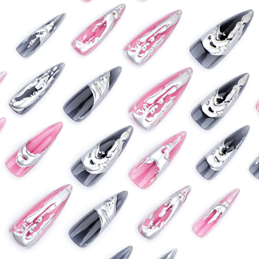 Creative stiletto nails with unique metallic details Bowlift