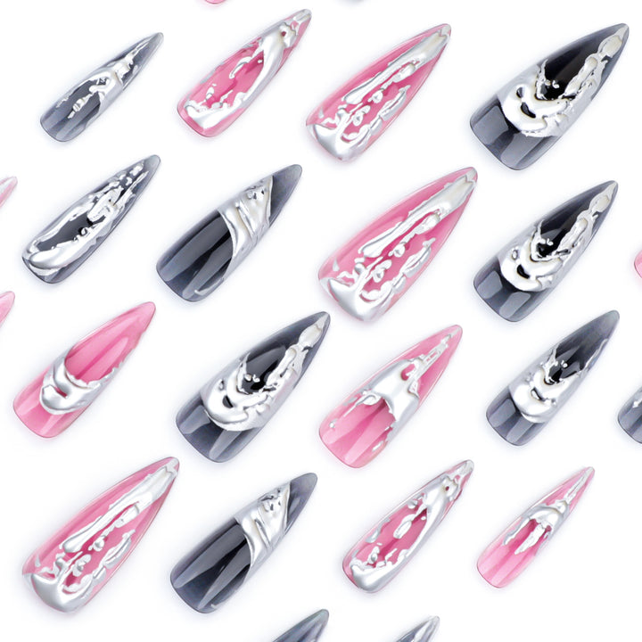 Creative stiletto nails with unique metallic details Bowlift