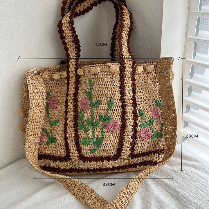 Braided shoulder bag with floral motif Bowlift