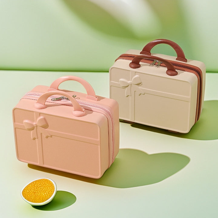 structured hard-shell cosmetic travel case with embossed bow and dual top handles Bowlift