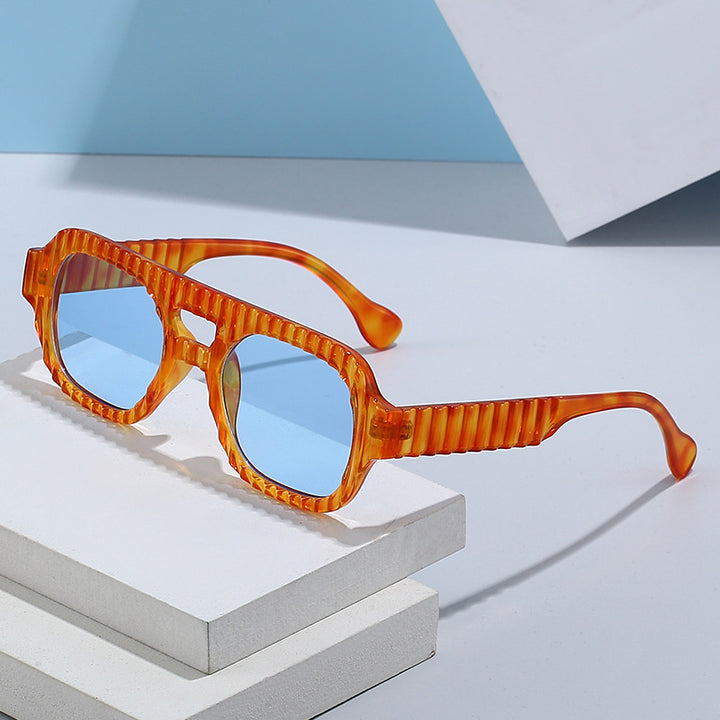 Ladies fashionable sunglasses in futuristic design with textured frame Bowlift
