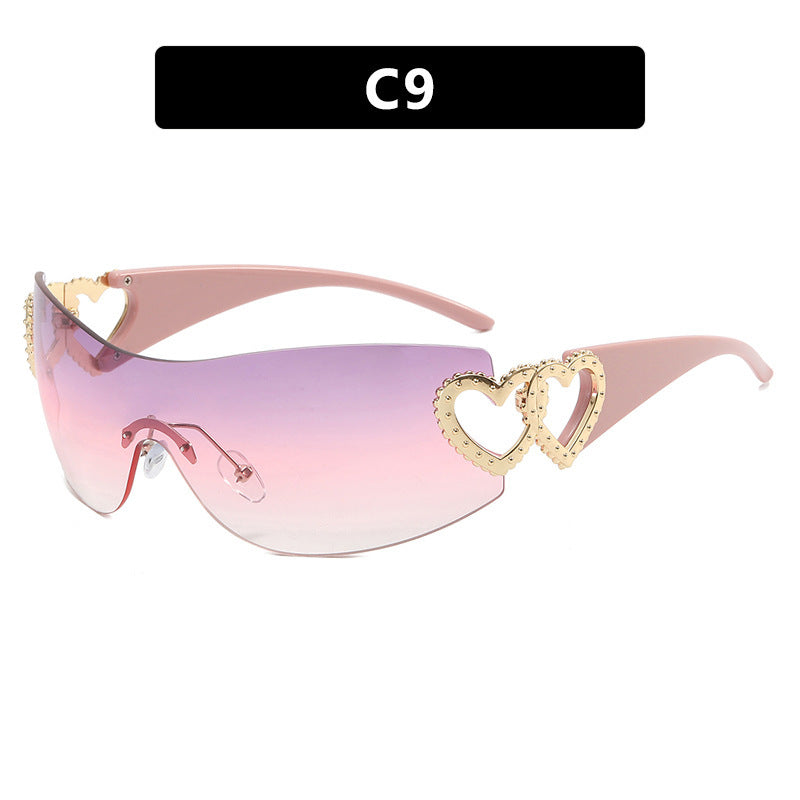 Ladies sporty sunglasses in trendy shield design with heart accents Bowlift