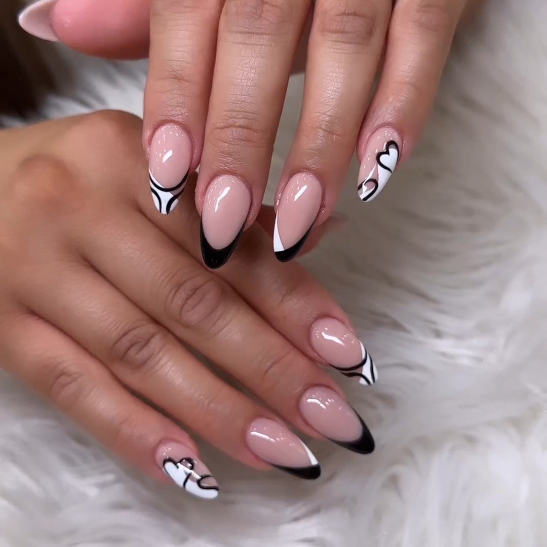 Artful stiletto nails with elegant black-and-white design Bowlift