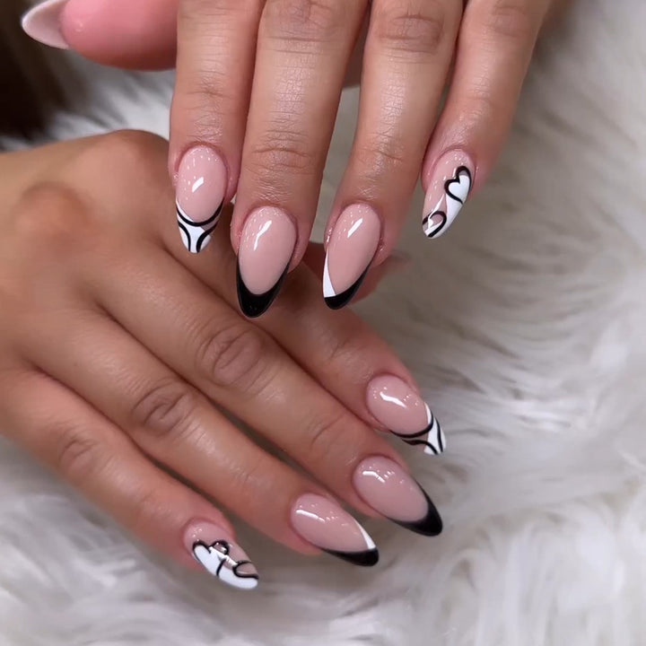 Artful stiletto nails with elegant black-and-white design Bowlift