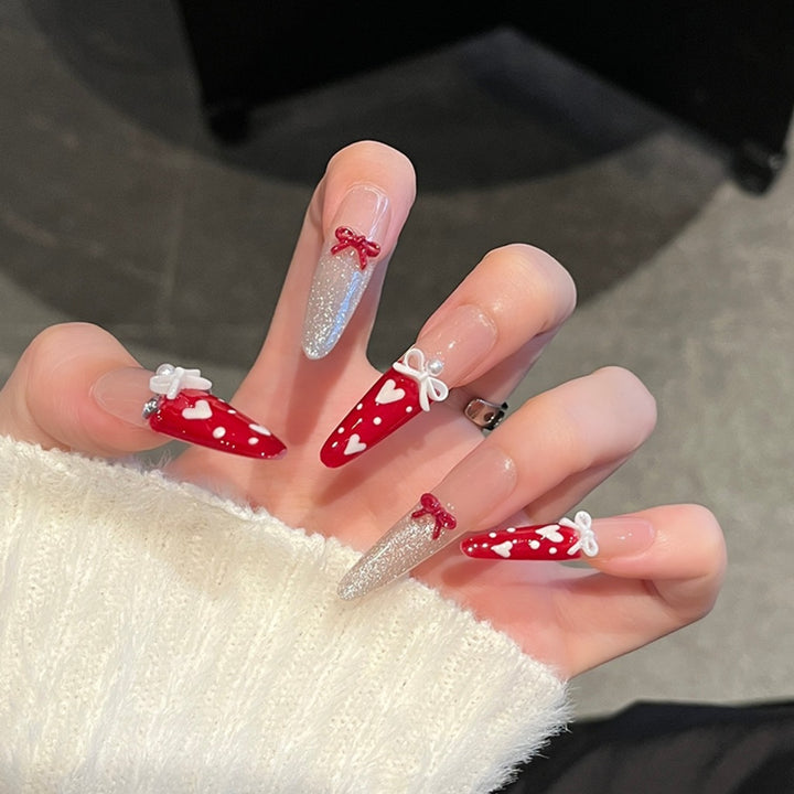 Artistic Stiletto Press-On Nail Art with Glimmering Accents Bowlift