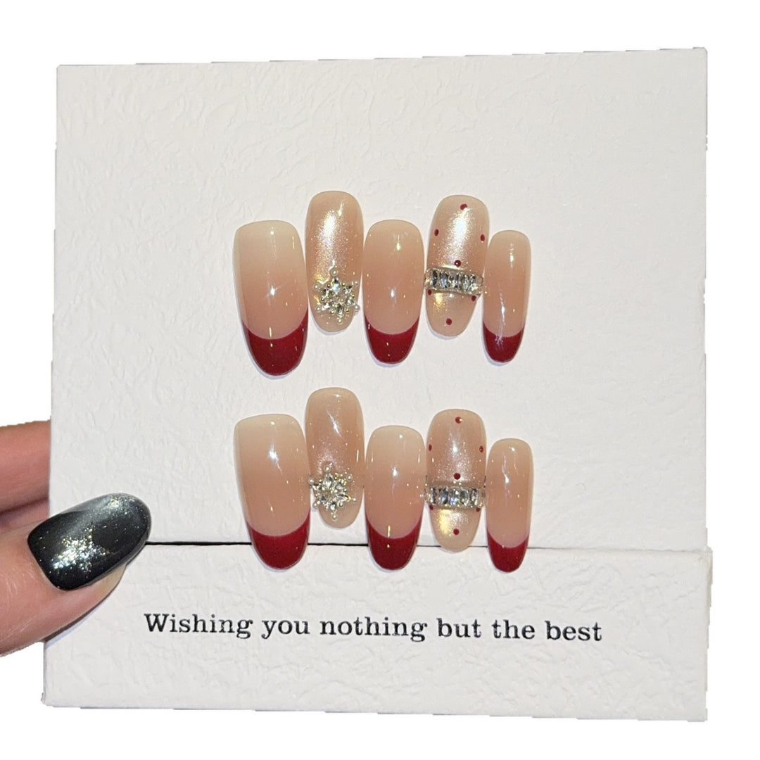 Artificial nails with festive design and rhinestone details Bowlift