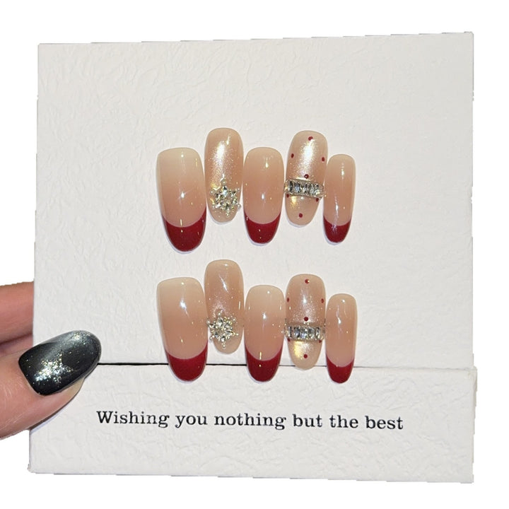 Artificial nails with festive design and rhinestone details Bowlift