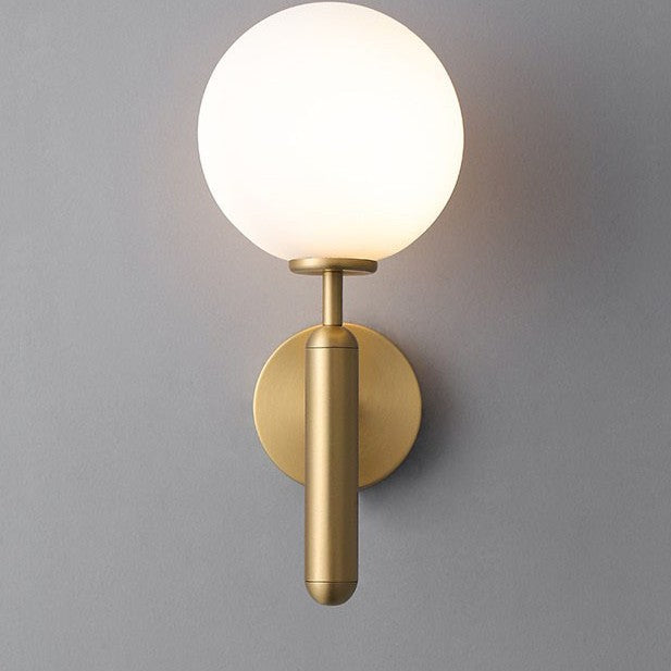 Modern wall sconce with opal glass globe and minimalist vertical stem Bowlift