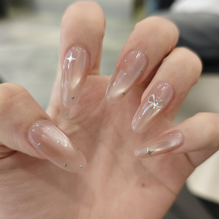 Elegant Stiletto Nail Tips with Bow Accents Bowlift