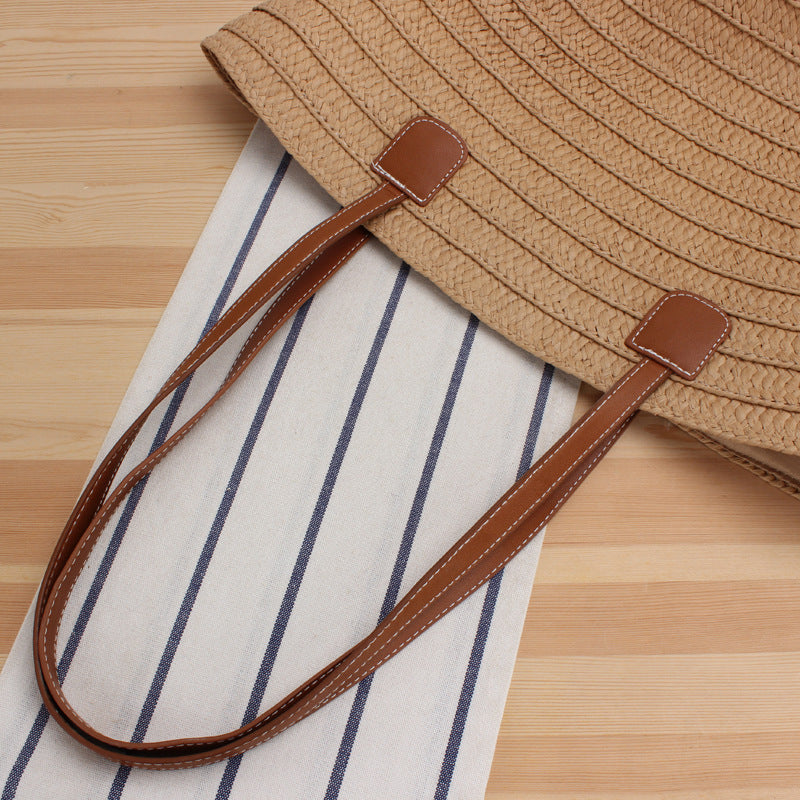 Elegant Shoulder Bag Made of Natural Raffia with High-Quality Leather Accents Bowlift