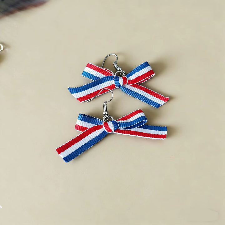 Women's handcrafted tassel earrings with flag medallion and pearl fringes Bowlift