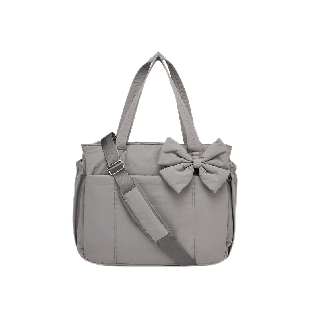 Practical tote bag with retractable shoulder strap and fashionable bow Bowlift
