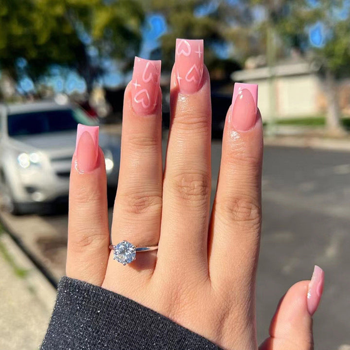 Artistic acrylic nails with heart design Bowlift