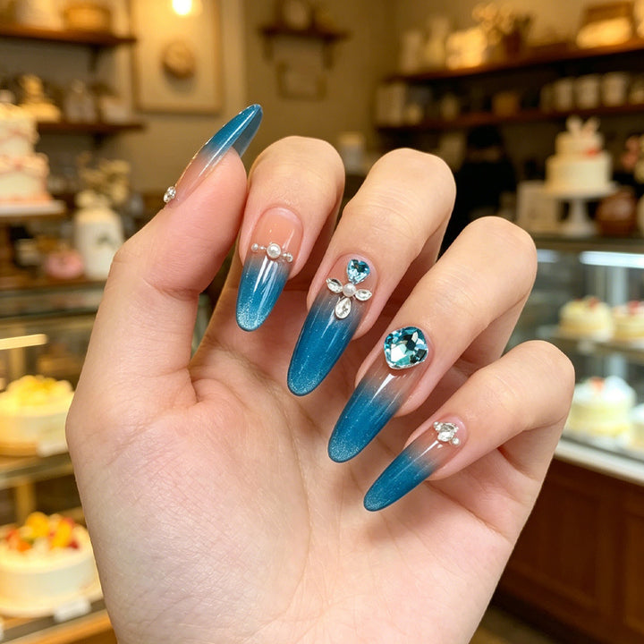 Artificial nails with glitter and rhinestone embellishments Bowlift