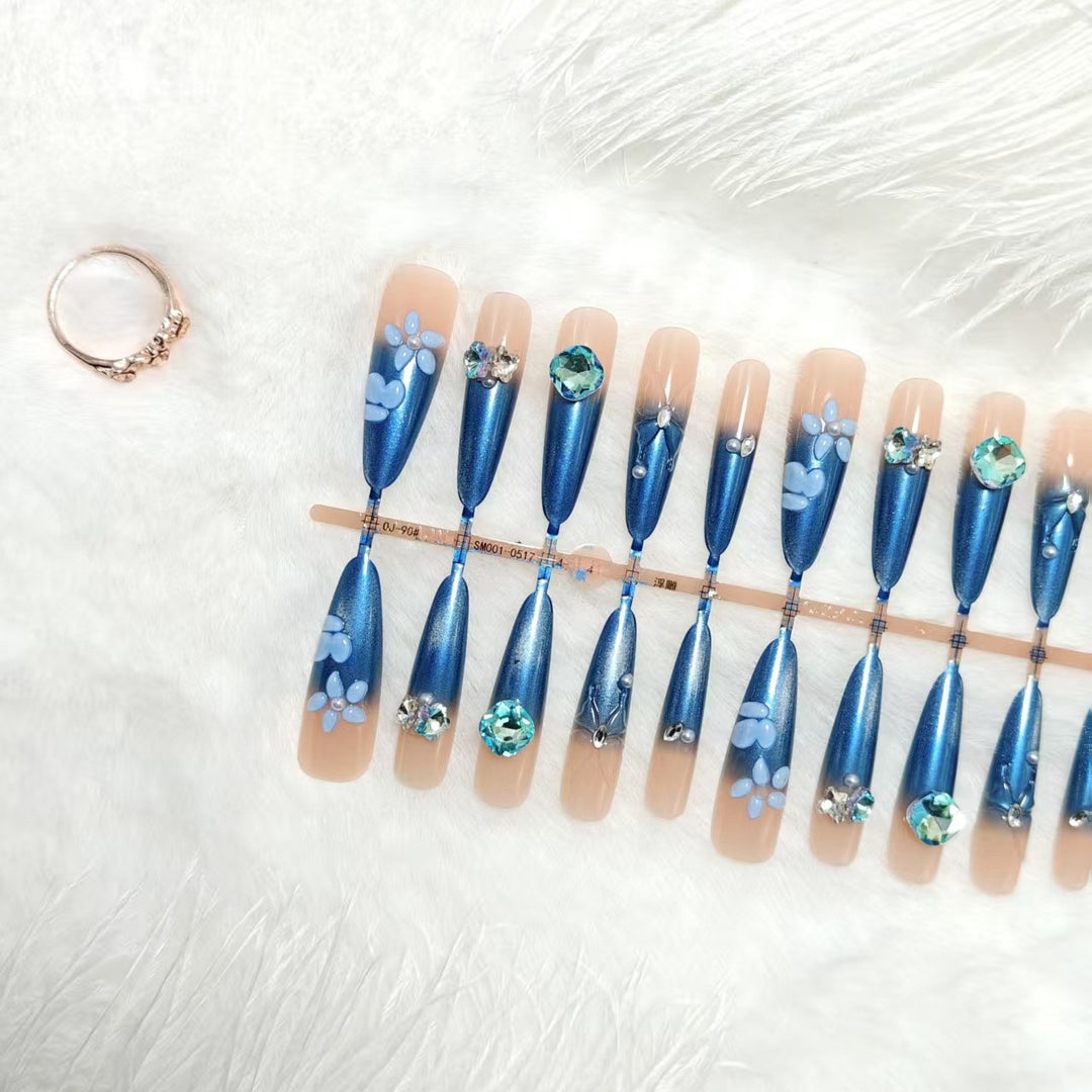 Elegant artificial nails with floral applications and glitter elements Bowlift