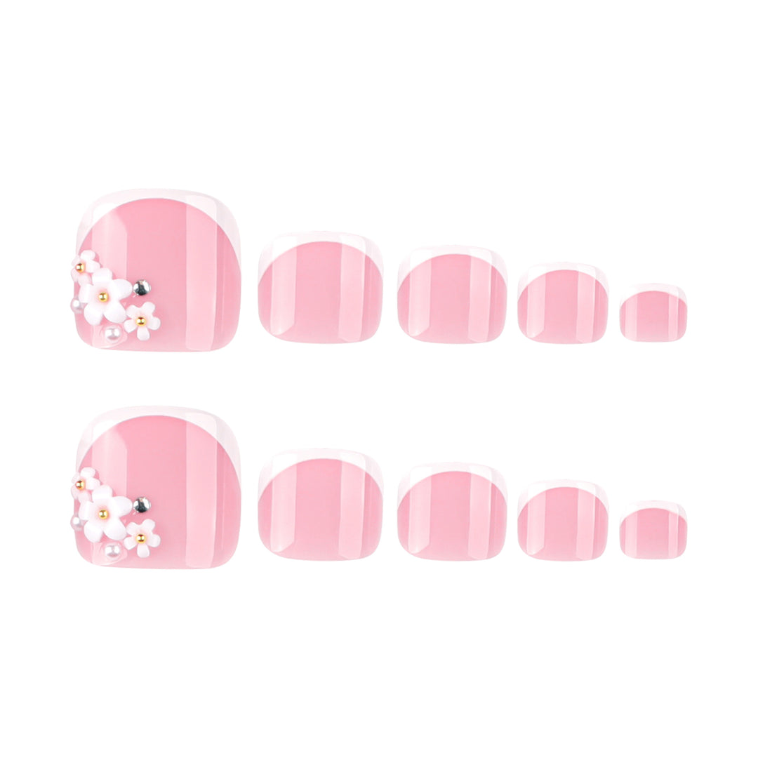 Artful toenail design with delicate flower and French tip accents Bowlift