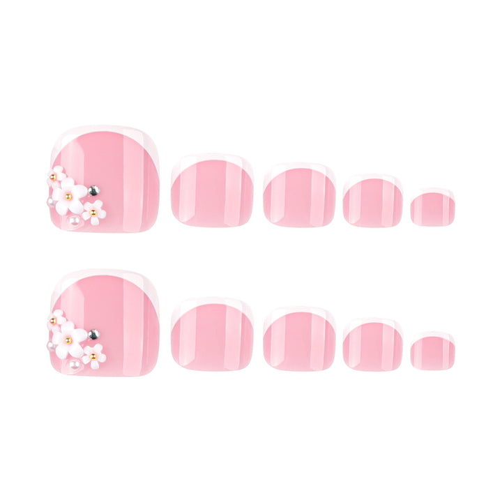 Artful toenail design with delicate flower and French tip accents Bowlift