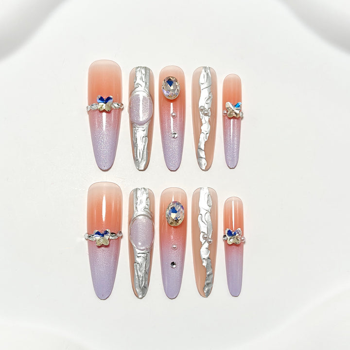 Artificial nails with elegant ombre design and jewelry accents Bowlift