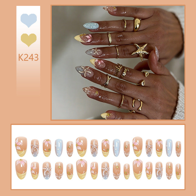 Artificial nail set with floral motifs and glitter accents Bowlift