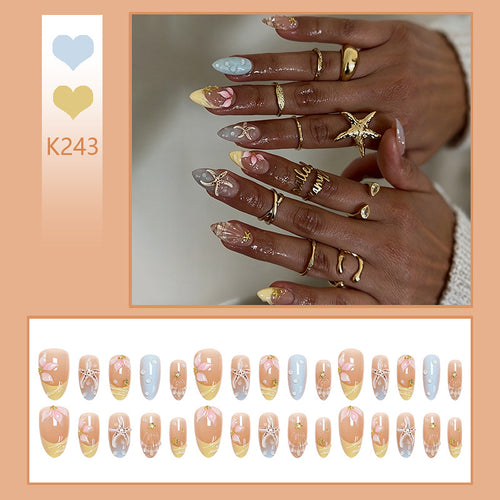 Artificial nail set with floral motifs and glitter accents Bowlift