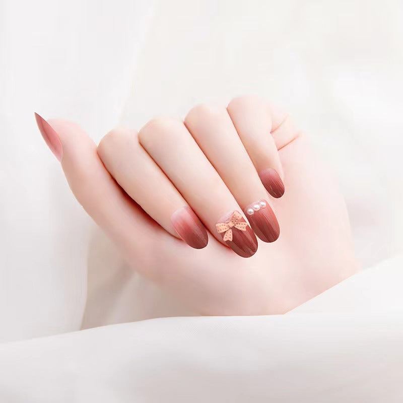 Artificial nails with glamorous bow and pearl decor Bowlift
