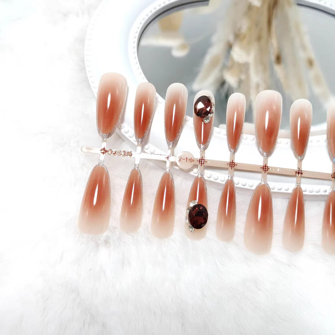 Glamorous artificial nails in elegant ombre style with rhinestone embellishments Bowlift