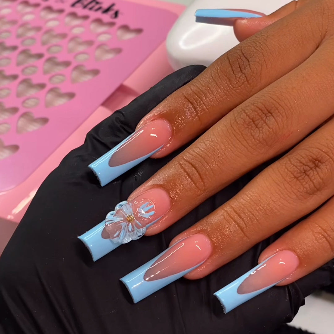 Artistic Long Press-On Nails with Floral Accents Bowlift