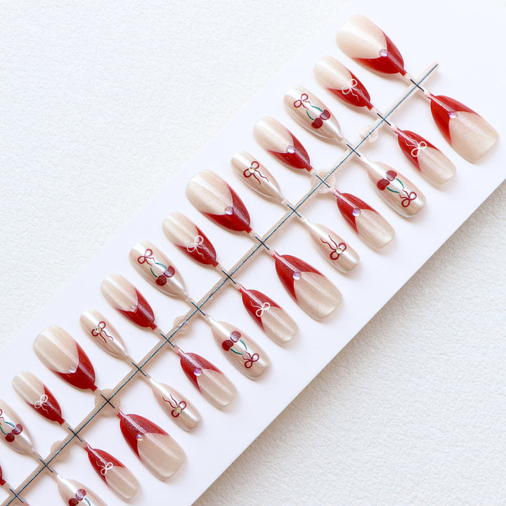 Artistic Press-On Nail Set with Cherry and Ribbon Design Bowlift