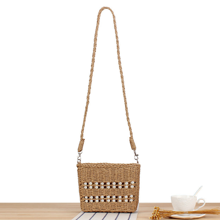 Handbag made of hand-woven natural material with pearl decoration Bowlift