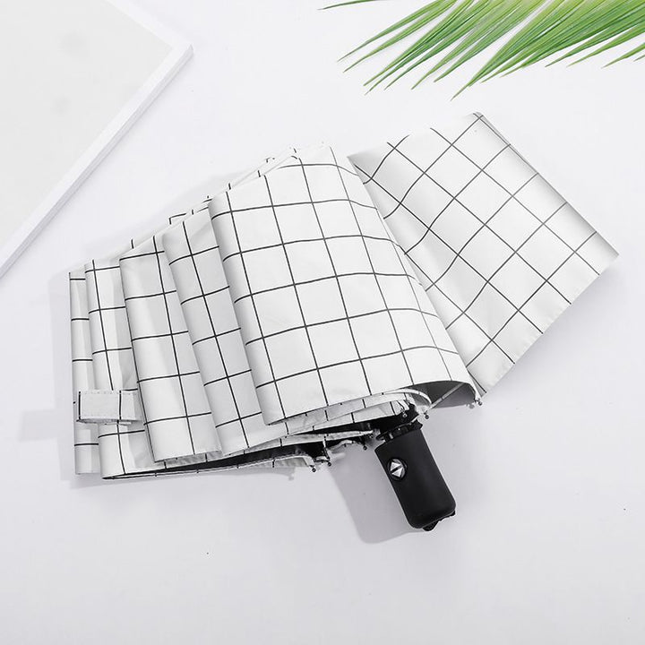 Compact Manual Eight-Rib Windproof Folding Umbrella with UV Protection and Grid Print Bowlift
