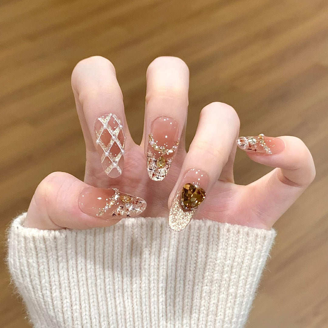 Glamorous artificial nails with glitter and heart design Bowlift