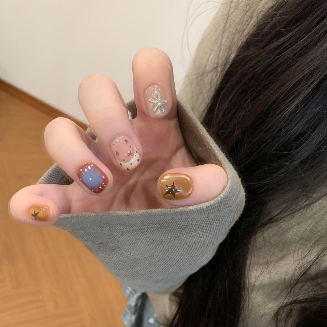 Artificial nails in modern design with star and gradient elements Bowlift